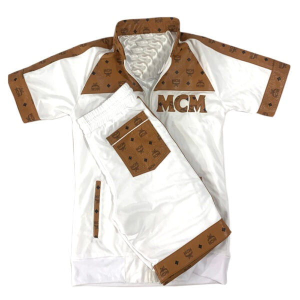 Men White shorts with brown accents and 'MCM' logo on a white background