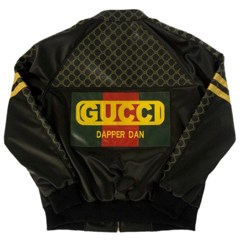 Mens Black bomber jacket with Gucci logo and 'Dapper Dan' text on a white background
