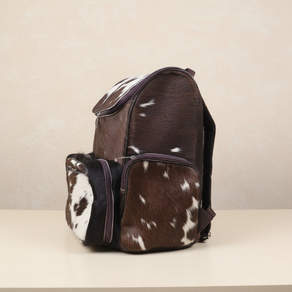 left angle of a brown cowhdie lether diaper backpack