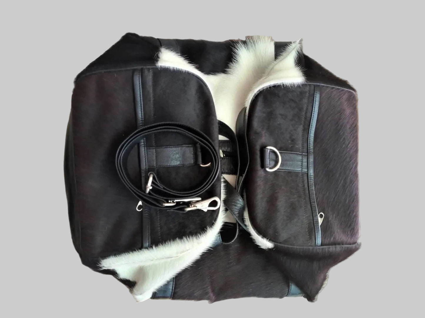 a folded angle of a cowhdie leather duffel bag