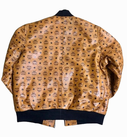 Men's MCM tan color bomber designer inspired leather jacket. Black knitted material on the collar, cuffs and hem