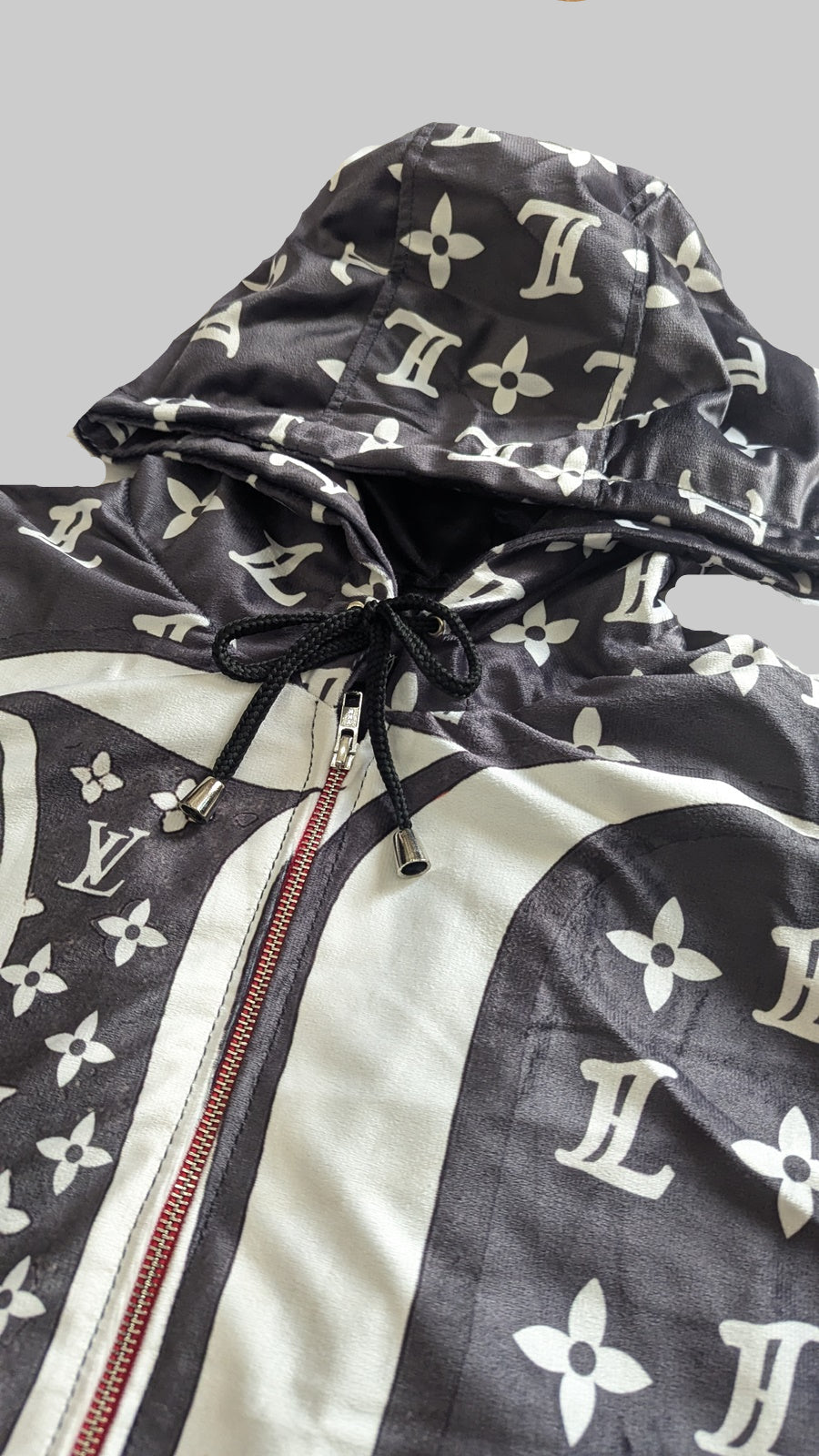 Louis Vuitton jacket with monogram pattern on a white surface