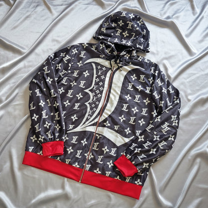 Charcoal Grey Hoodie with LV pattern with red knitting on wrist and hem flat layed on a white surface