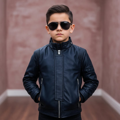 Child wearing a dark blue jacket and sunglasses on a blurred background