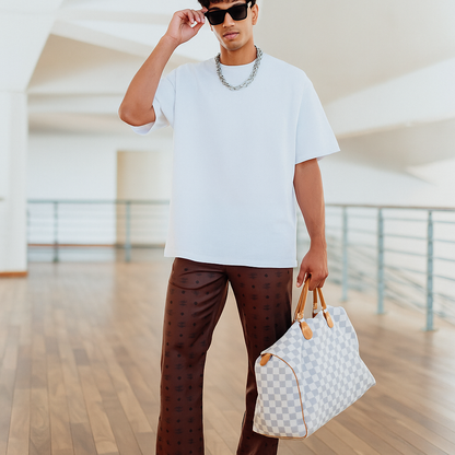 MCM Monogram Leather Pants with white shirt and checkered bag