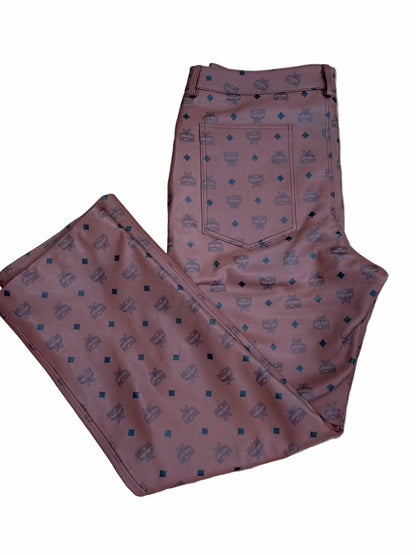 MCM Monogram Leather Pants flat on white background showing back pockets design and belt loops