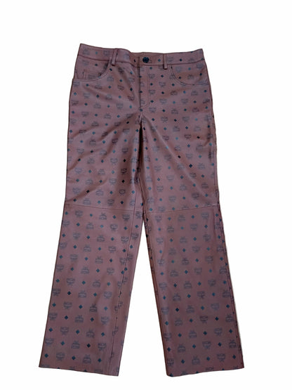 MCM Monogram Leather Pants flat lay on white background