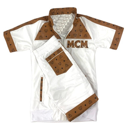 Men White shorts with brown accents and 'MCM' logo on a white background