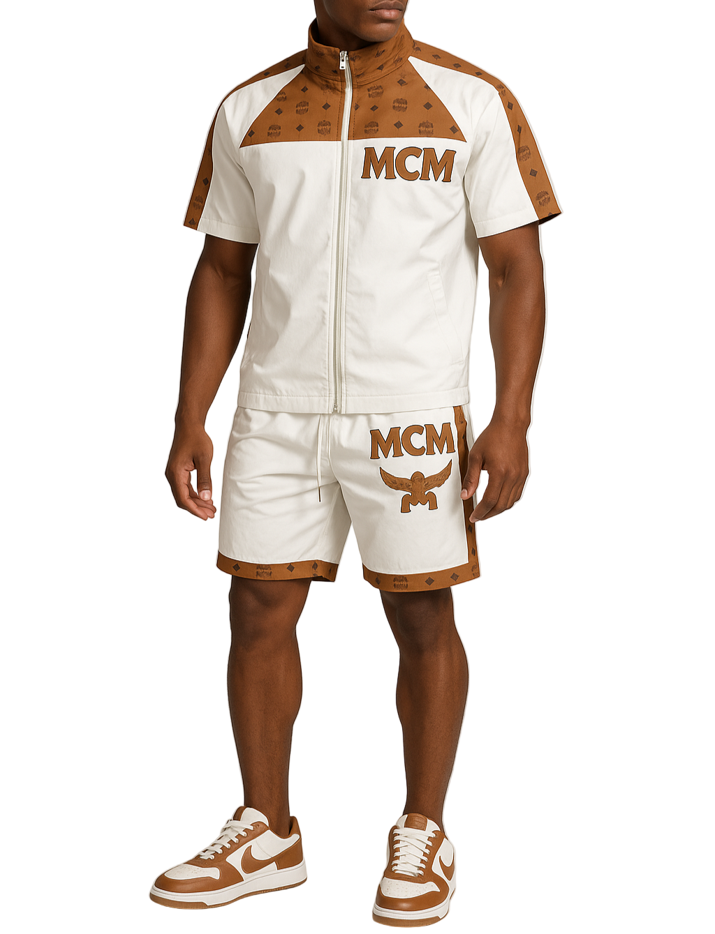 Man wearing a matching tracksuit with 'MCM' branding on a plain background