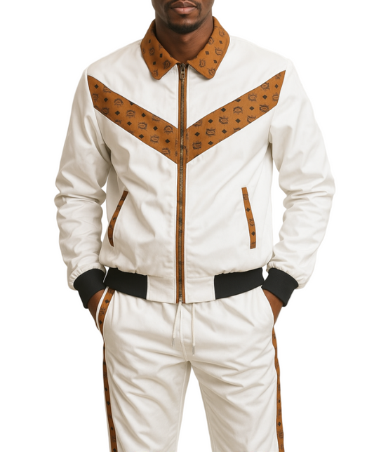 Man wearing a MCM white and brown tracksuit on a plain background