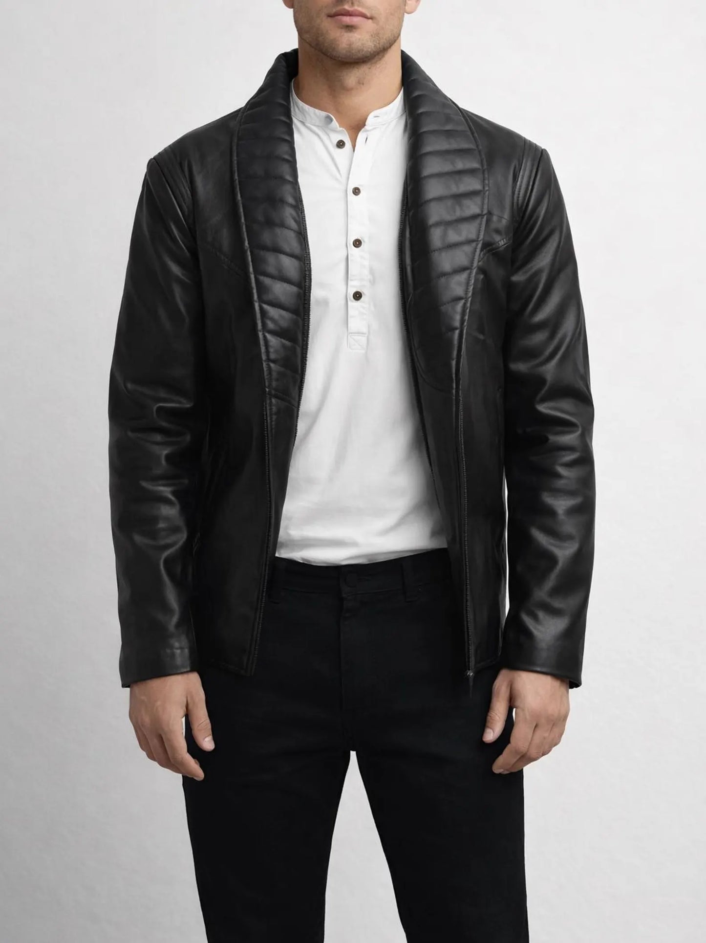 Man wearing a black leather Michael Jackson Billie jean Jacket over a white shirt on a light gray background