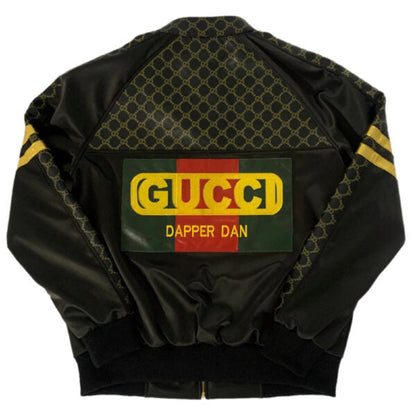 Mens Black bomber jacket with Gucci logo and 'Dapper Dan' text on a white background