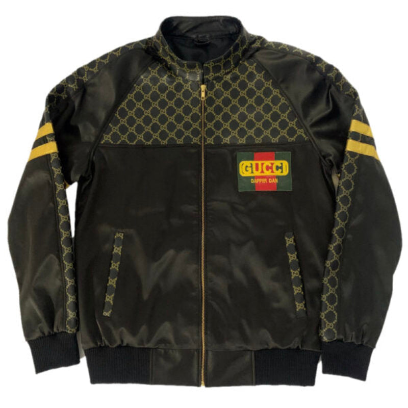 Black bomber jacket with patterned accents and Gucci logo on a white background