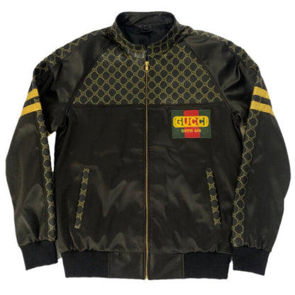 Black bomber jacket with patterned accents and Gucci logo on a white background