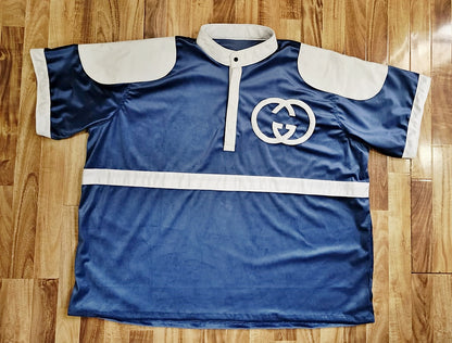 Blue velvet sports jersey with white accents on a wooden floor