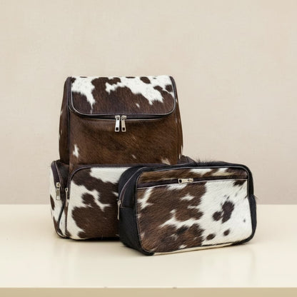 a brown weatern cowhide leather backpack with a tech puch , diapering kit