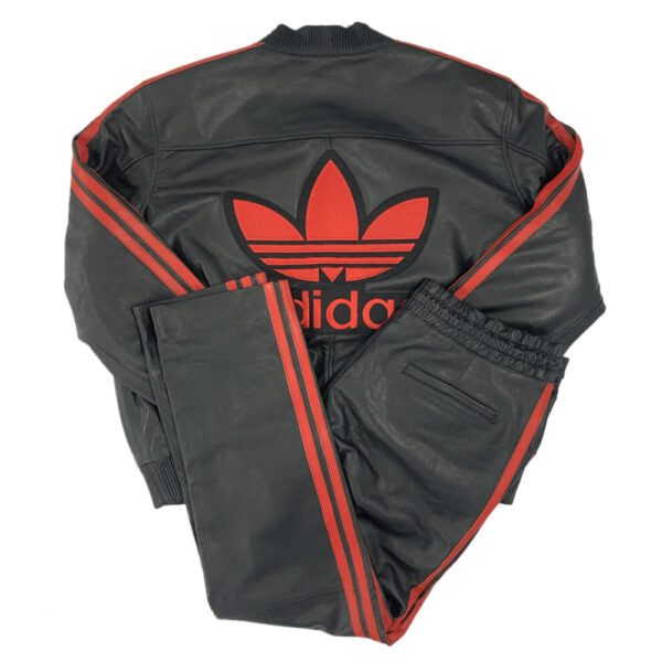 Black leather tracksuit with red Adidas logo on a white background