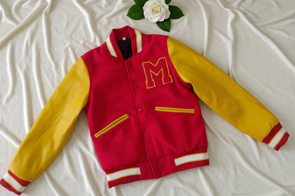 Red and yellow jacket with number 3 on a textured surface