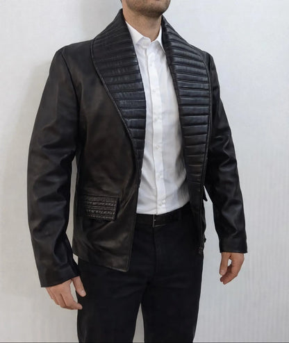 Man wearing a black leather Michael Jackson Billie jean Jacket over a white shirt on a light gray background
